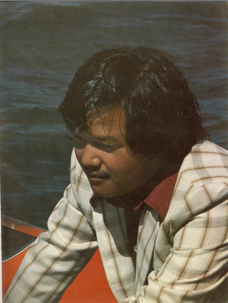 Prem Rawat Inspirational Speaker In a Loud Coat In A Speed Boat