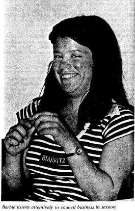 Barbie listens attentively to council business in session