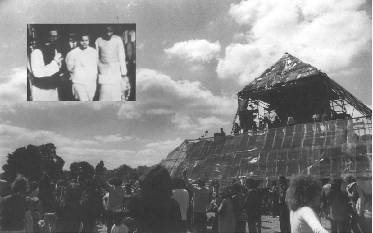 The pyramid stage at Glastonbury's free festival. Maharaji arrives to speak on it with Charnanand and Ron Geaves